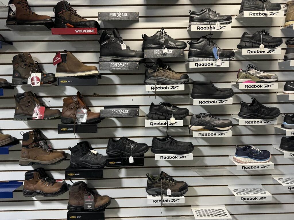 Display wall with Reebok, Keen, Wolverine, and other athletic-style work shoes